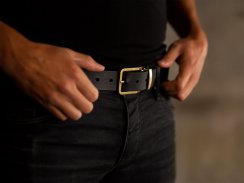Black leather belt with gold buckle
