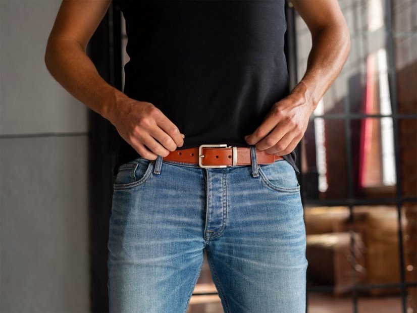 Brown leather belt with stitching and silver buckle